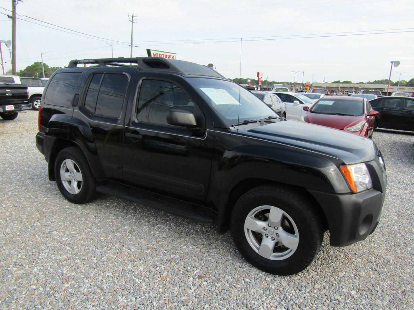 2005 Black /BROWN/TAN Nissan Xterra (5N1AN08U85C) with an 6 Cyl engine, Automatic transmission, located at 15016 S Hwy 231, Midland City, AL, 36350, (334) 983-3001, 31.306210, -85.495277 - Photo#0